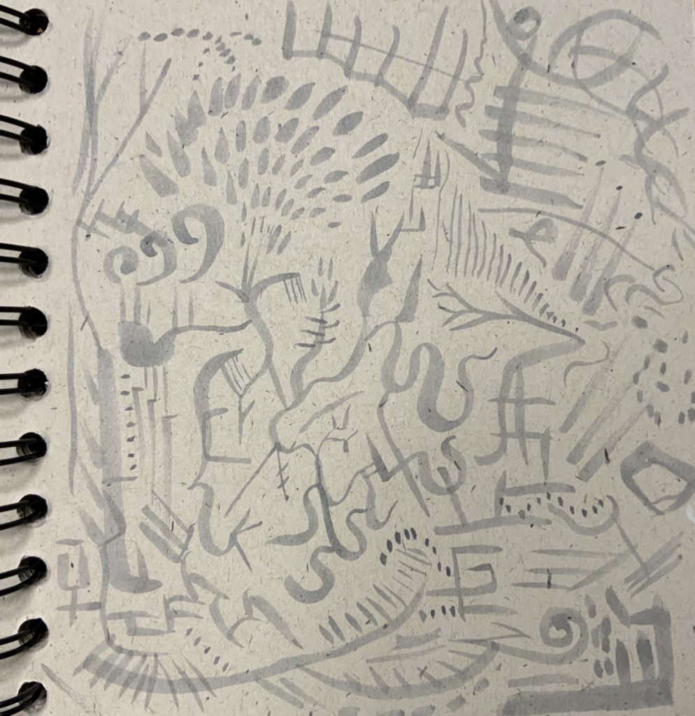 gray marker on notebook random doodles
