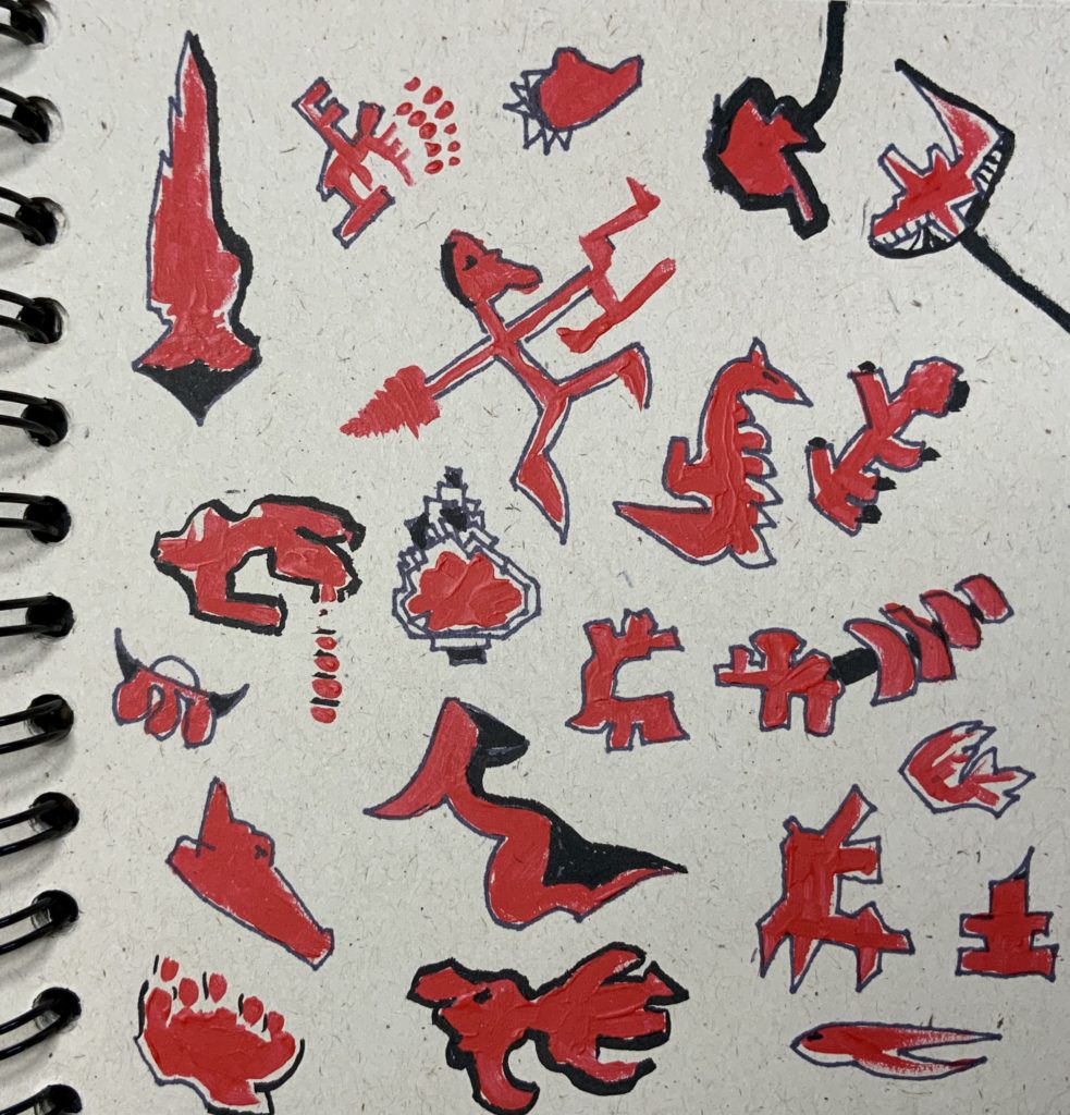 doodles in pen filled in with red ink